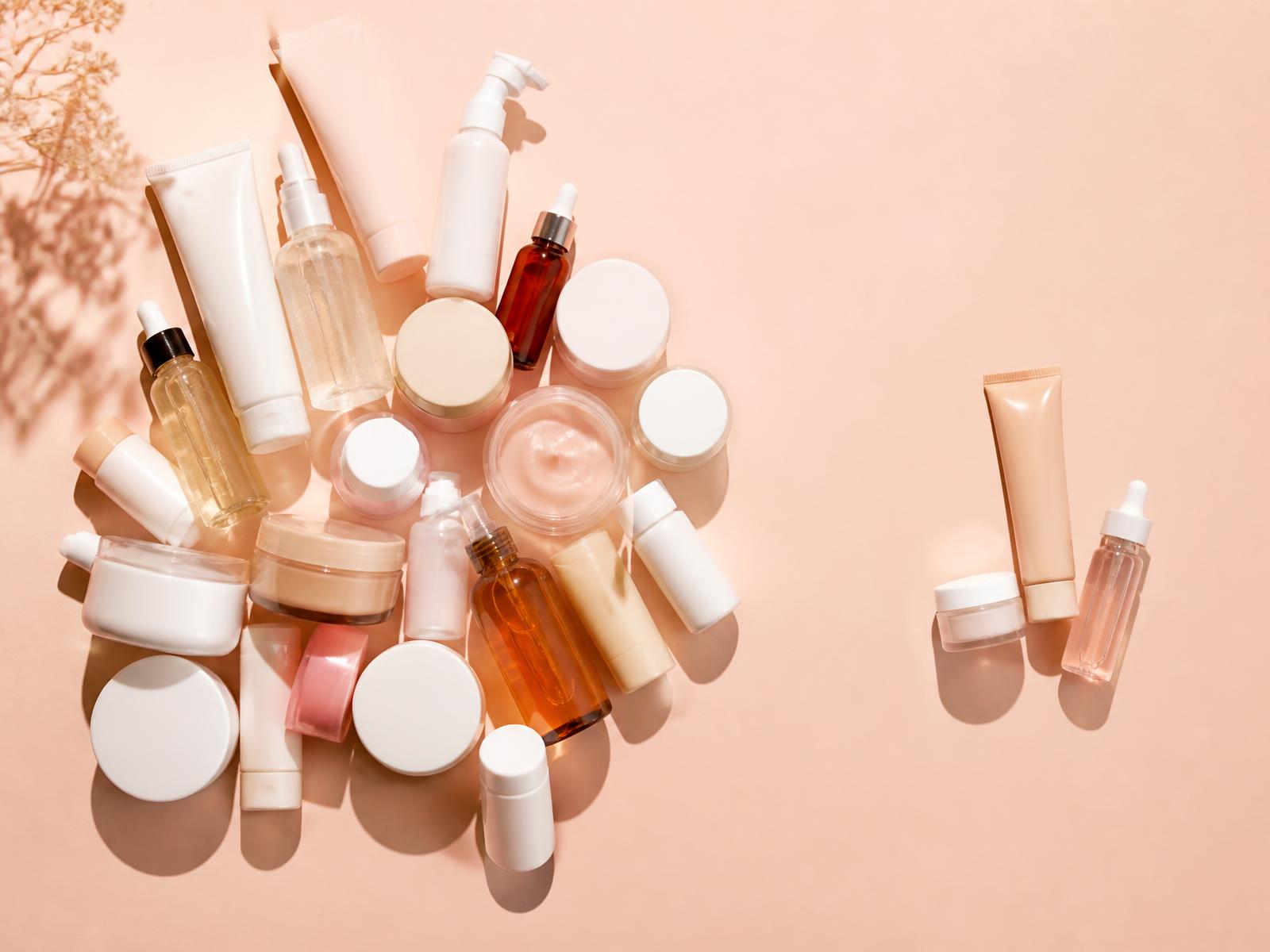 Many unbranded skincare products with a few set aside